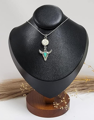 Handcrafted necklace with 9mm bullet casing and faux turquoise bull charm